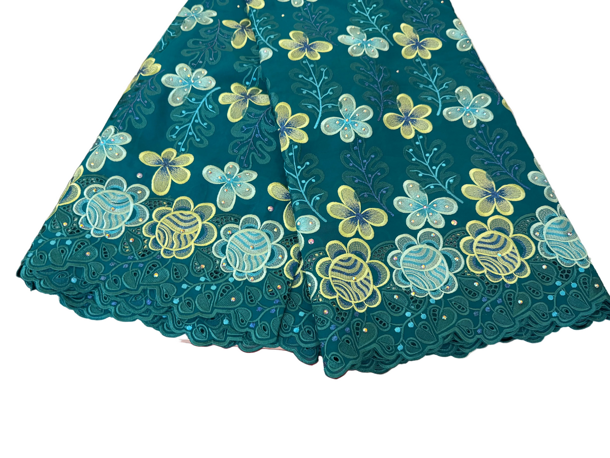 Floral patterned fabric on a table with a red and gray surface underneath